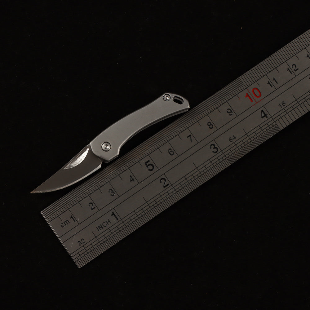 MASALONG MA-TY-014 Unboxing a high-hardness, mini stainless steel folding tool—a portable keychain accessory with a creative design.