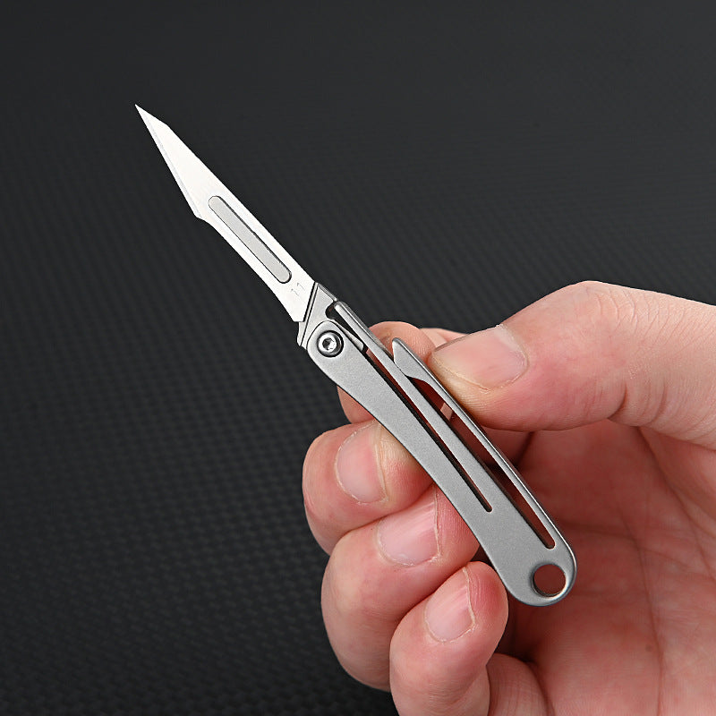 MASALONG MA-TY-012 Mini cuchillo plegable de aleación de titanio, cuchillo afilado para cortar papel artístico, hoja reemplazable, desempaquetado y desempaquetado portátil, cuchillo llavero de entrega exprés
