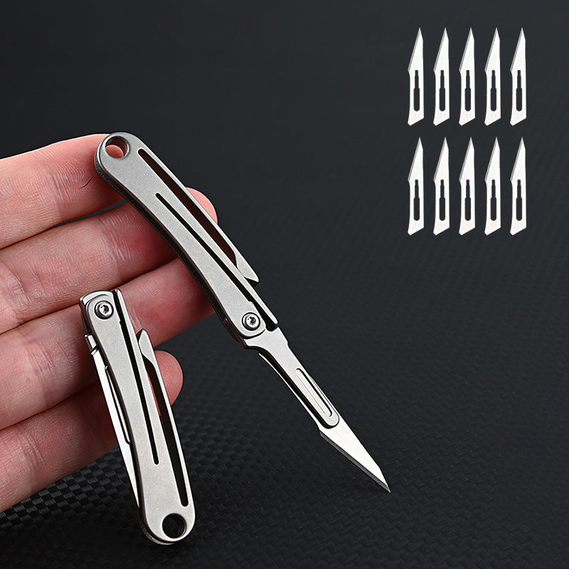 MASALONG MA-TY-012 Mini cuchillo plegable de aleación de titanio, cuchillo afilado para cortar papel artístico, hoja reemplazable, desempaquetado y desempaquetado portátil, cuchillo llavero de entrega exprés