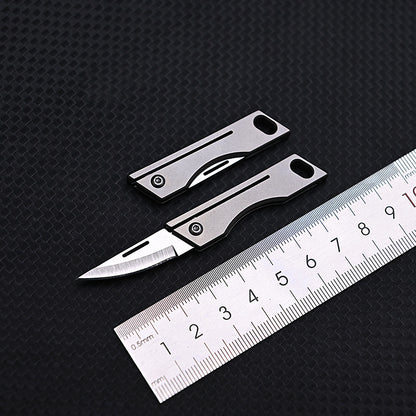 MASALONG MA-TY-007 Mini faca dobrável de liga de titânio, faca pequena afiada de aço D2 de alta dureza, chaveiro portátil, peças para pendurar, desembalar, entrega expressa e desembalar faca pequena