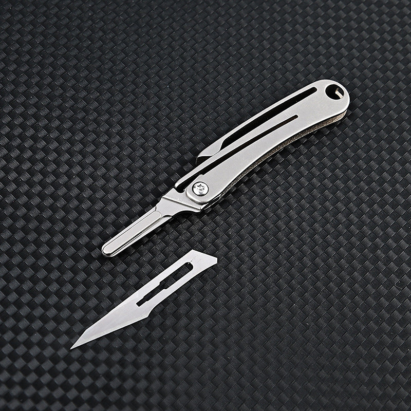 MASALONG MA-TY-012 Mini cuchillo plegable de aleación de titanio, cuchillo afilado para cortar papel artístico, hoja reemplazable, desempaquetado y desempaquetado portátil, cuchillo llavero de entrega exprés
