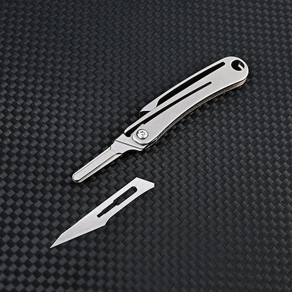 MASALONG MA-TY-012 Mini cuchillo plegable de aleación de titanio, cuchillo afilado para cortar papel artístico, hoja reemplazable, desempaquetado y desempaquetado portátil, cuchillo llavero de entrega exprés