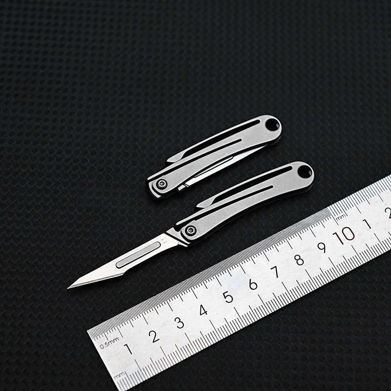 MASALONG MA-TY-012 Mini cuchillo plegable de aleación de titanio, cuchillo afilado para cortar papel artístico, hoja reemplazable, desempaquetado y desempaquetado portátil, cuchillo llavero de entrega exprés