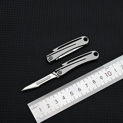 MASALONG MA-TY-012 Mini cuchillo plegable de aleación de titanio, cuchillo afilado para cortar papel artístico, hoja reemplazable, desempaquetado y desempaquetado portátil, cuchillo llavero de entrega exprés